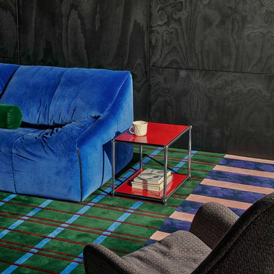 USM Haller side table M21 in Ruby Red in a living room setting