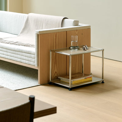USM Haller side table M22 next to a sofa